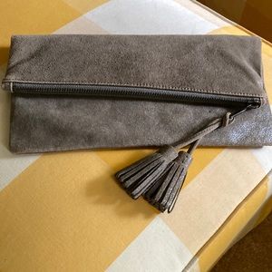 Worth leather taupe clutch or wristlet . Comes with tassels GUC.